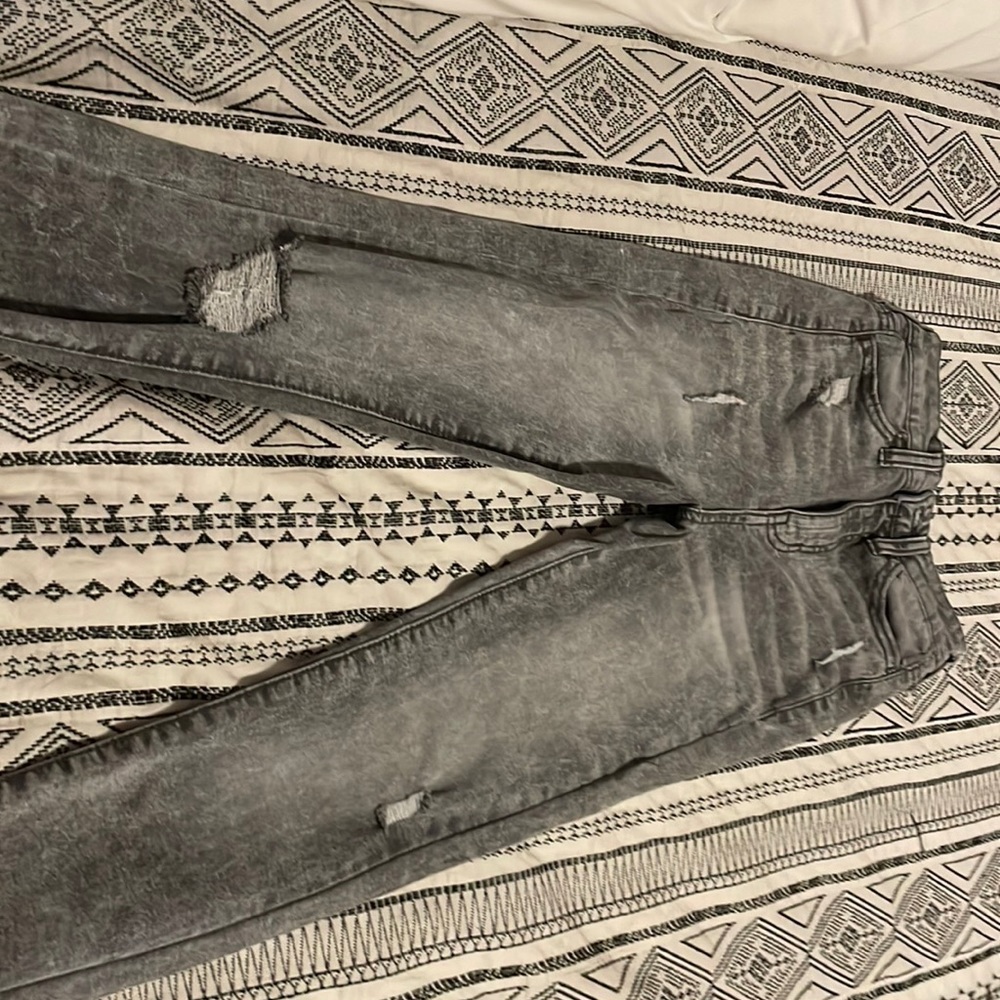 Gray and black skinny jeans